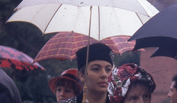 Sample scan - original scan of a  woman at a wedding under a umbrella