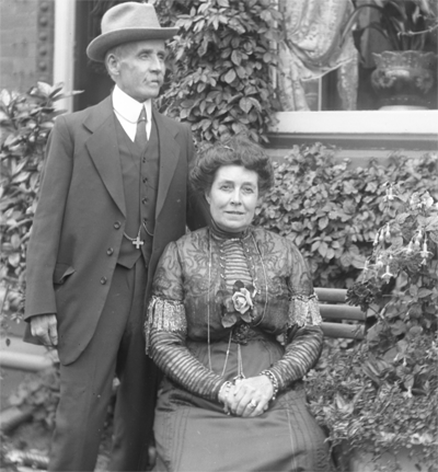 Scanned image from a glass slide, showing a couple posing for a picture in the early 20th century